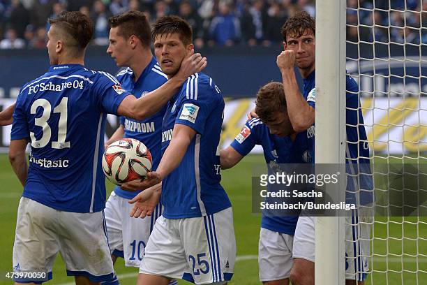 Players of Schalke celebrate after scoring the opening goal during the Bundesliga match between FC Schalke 04 and SC Paderborn on May 16, 2015 in...