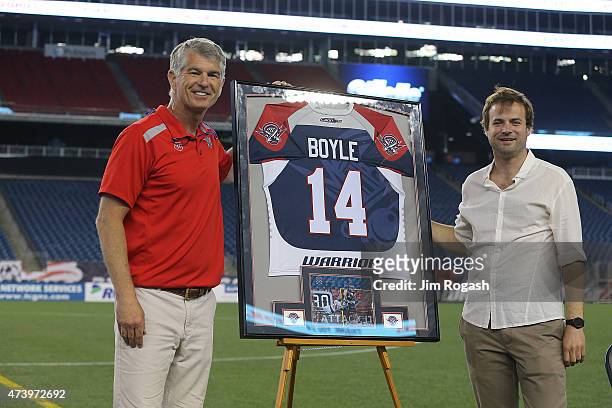 Ryan Boyle, former Boston Cannons player, stands with John Tucker during a ceremony in Boyle's honor after a game with the Rochester Rattlers at...