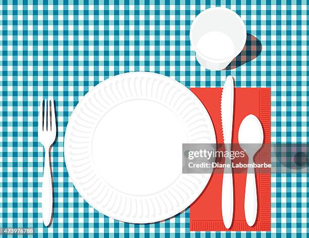 place setting with dinner plate, utensils,glass on checkered blue - blue glass plate stock illustrations