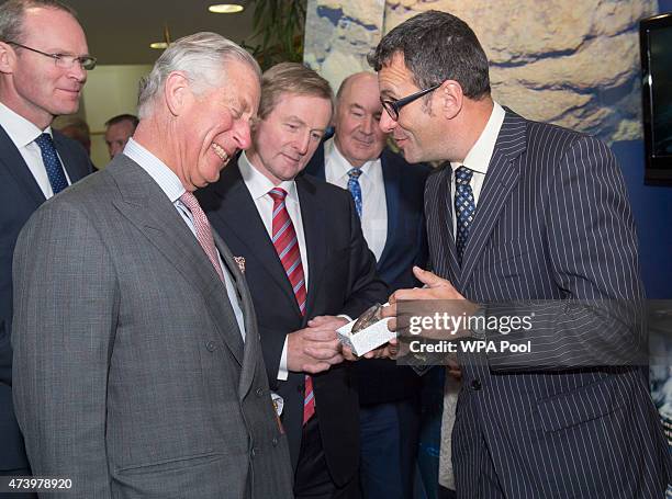 Irish Taoiseach Enda Kenny looks on as a 330 million year old fossil from near Mullaghmore was presented to Prince Charles, Prince Of Wales by...