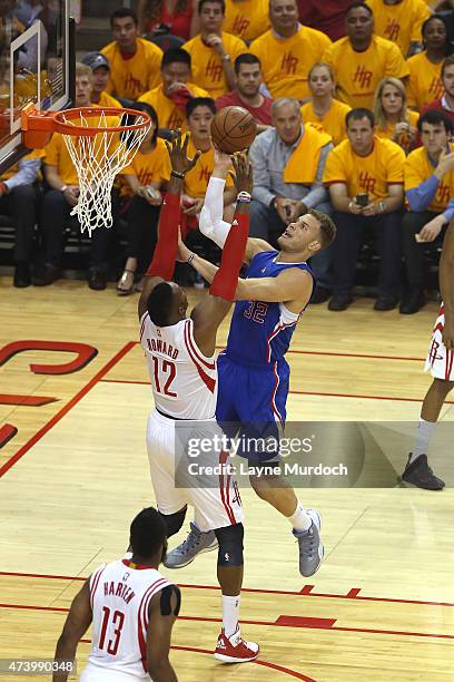 Blake Griffin of the Los Angeles Clippers shoots the ball against Dwight Howard of the Houston Rockets in Game 5 of the NBA Western Conference...