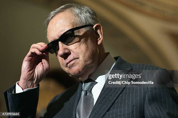 Senate Minority Leader Harry Reid talks to reporters after the weekly Democratic policy luncheon at the U.S. Capitol May 19, 2015 in Washington, DC....