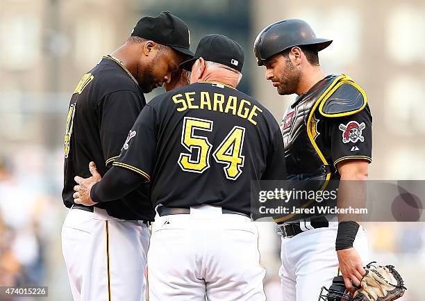 Francisco Liriano of the Pittsburgh Pirates is visited at the mound by pitching coach Ray Searage and Francisco Cervelli in the second inning against...