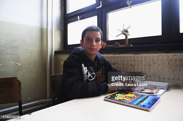 Kosovo Albanian student is seen in his classroom during a LMT activity carried out by Italian KFOR soldiers after the sixth anniversary of Kosovo's...