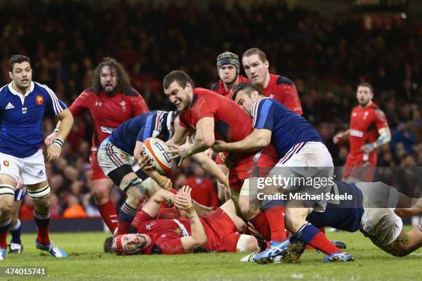 Sam Warburton of Wales scores a try as Nicolas Mas of fails to hold him up during the RBS Six Nations match between Wales and France at the...