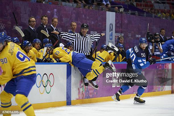 Winter Olympics: Finland Juhamatti Aaltonen in action vs Sweden Alexander Edler during Men's Playoffs Semifinals at Bolshoy Ice Dome. Lundqvist makes...