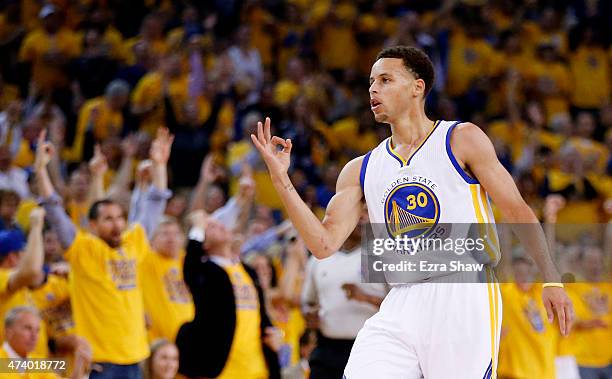 Stephen Curry of the Golden State Warriors celebrates a three-pointer in the first quarter against the Houston Rockets during Game One of the Western...