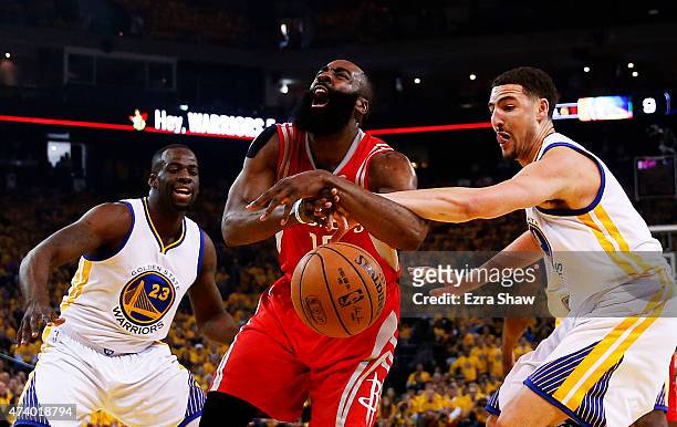 Dwight Howard of the Houston Rockets is fouled by Klay Thompson of the Golden State Warriors in the first quarter during Game One of the Western...