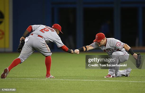 Kole Calhoun of the Los Angeles Angels of Anaheim celebrates their victory with Erick Aybar during MLB game action against the Toronto Blue Jays on...
