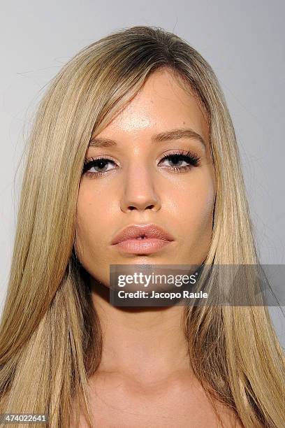 Model Georgia May Jagger prepares backstage ahead of the Versace Fashion Show during Milan Fashion Week Womenswear Autumn/Winter 2014 on February 21,...