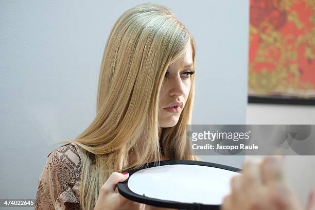 Model Georgia May Jagger prepares backstage ahead of the Versace Fashion Show during Milan Fashion Week Womenswear Autumn/Winter 2014 on February 21,...