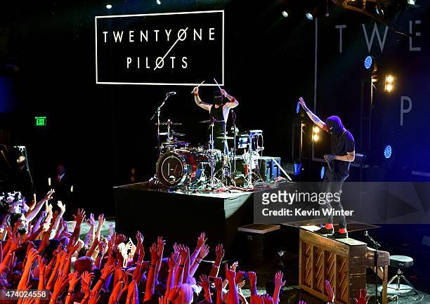 Musicians Josh Dun and Tyler Joseph of Twenty One Pilots perform onstage during the iHeartRadio Live Series with Twenty One Pilots at the iHeartRadio...