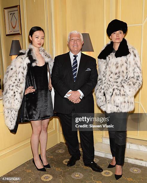 Designer Dennis Basso poses with models wearing his lattest collection at "High Tea High Fashion with Dennis Basso" benefiting New York Botanical...