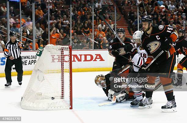 Marcus Kruger of the Chicago Blackhawks gets the puck past goaltender Frederik Andersen of the Anaheim Ducks to win the game 3-2 in triple overtime...