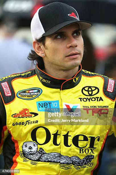 German Quiroga, driver of the OtterBox Toyota, stands on the grid during qualifying for the NASCAR Camping World Truck Series NextEra Energy...