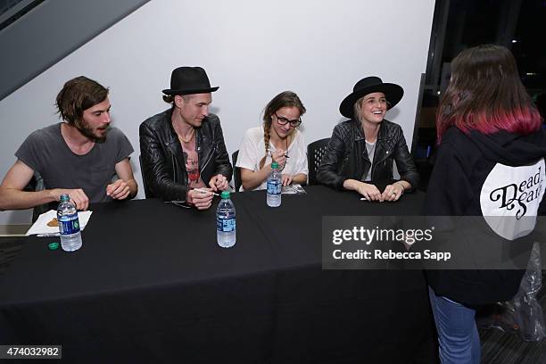 Sean Friday, Chris Null, Siouxsie Medley and Emily Armstrong of Dead Sara greet a fan at Homegrown: Dead Sara at The GRAMMY Museum on May 19, 2015 in...