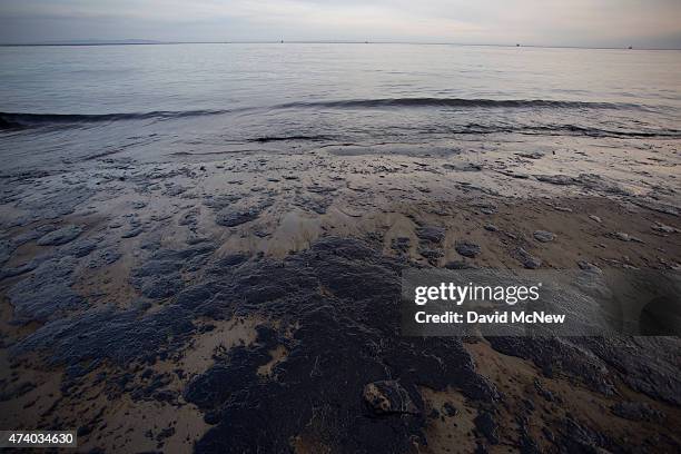 Spilled oil covers the beach at Refugio State Beach as the Channel Islands are seen in the distance on May 19, 2015 north of Goleta, California....