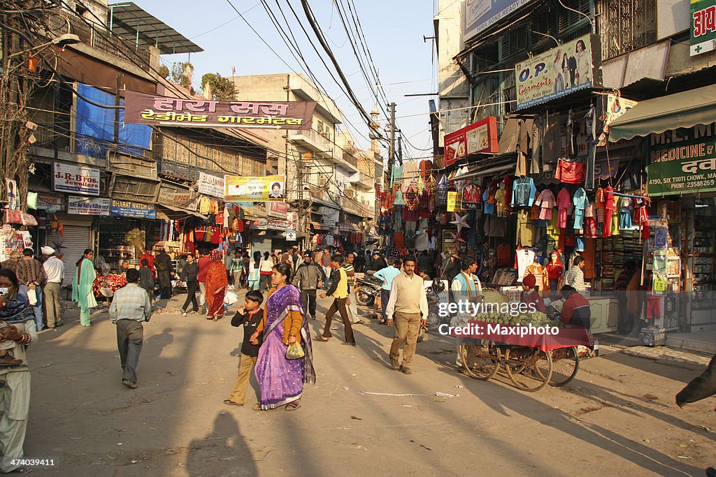 India streetlife: people crowd market streets of New Delhi