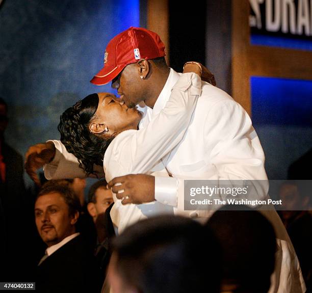 Location:New York, N.Y. .neg#143915 photo by: Jonathan Newton/staff caption:LeBron James recieves a hug from his mother, Gloria, when he was selected...