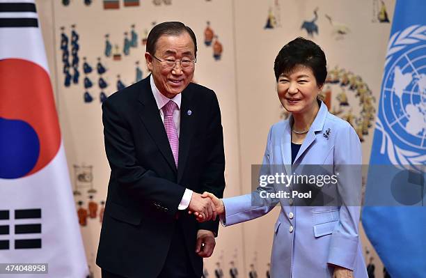 Secretary General Ban Ki-moon shakes hands with South Korean President Park Geun-Hye during their meeting at the presidential Blue House on May 20,...