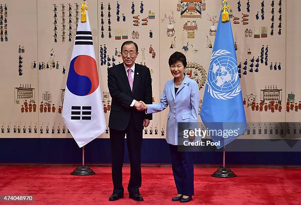 Secretary General Ban Ki-moon shakes hands with South Korean President Park Geun-Hye during their meeting at the presidential Blue House on May 20,...