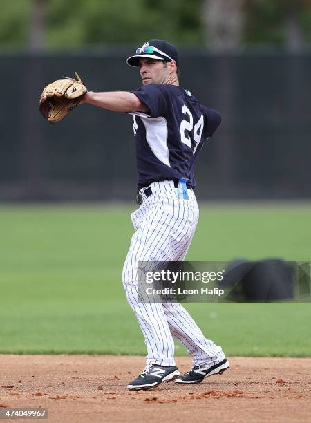 Scott Sizemore of the New York Yankees goes through the infield drills during spring training at George M. Steinbrenner Field on February 21, 2014 in...