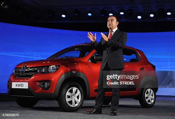 Indian Renault Chairman and CEO Carlos Ghosn talks during the launch of the compact hatchback 'Kwid' car in Chennai on May 20, 2015. Renault launched...