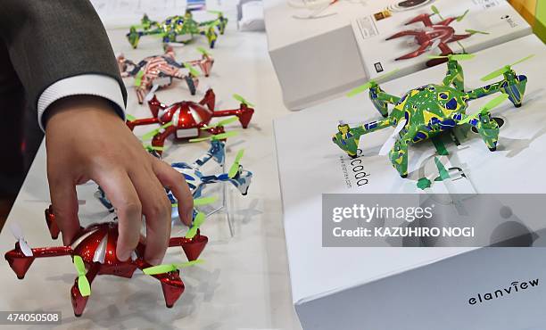 Alien-X6 drones with an attached digital camera are displayed during the International Drone Expo at the Makuhari Messe in Chiba, suburban Tokyo on...
