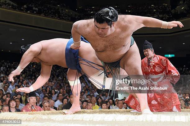 Takayasu throws Mongolian wrestler Kyokushuho to win during day ten of the Grand Sumo Summer Tournament at Ryogoku Kokugikan on May 19, 2015 in...