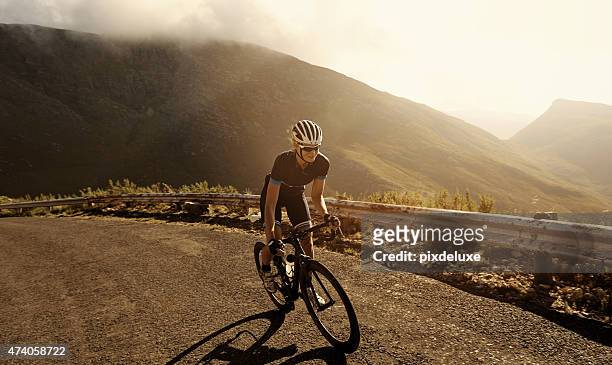racing towards her fitness goal - cycling stock pictures, royalty-free photos & images