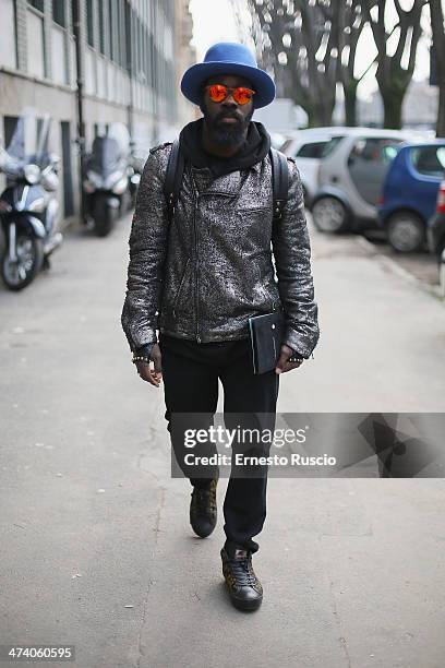 Cyprien Richiardi wears Drome coat, Alexander Smith shoes, MCM bag and Kyme sunglasses on day 3 of Milan Fashion Week Womenswear Autumn/Winter 2014...