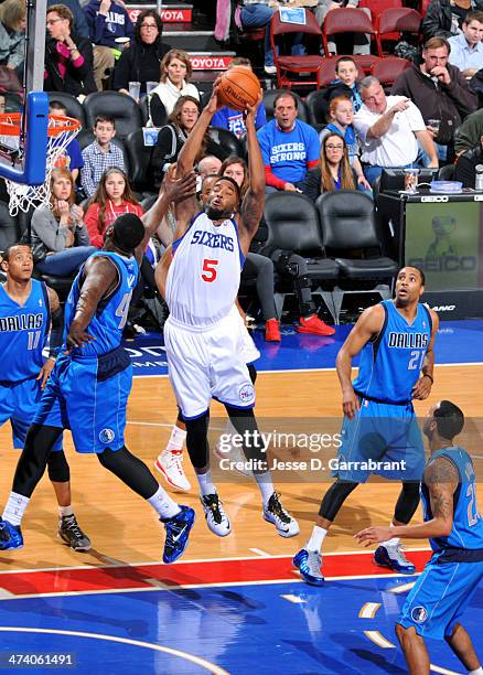 Arnett Moultrie of the Philadelphia 76ers dunks against the Dallas Mavericks at the Wells Fargo Center on February 21, 2014 in Philadelphia,...