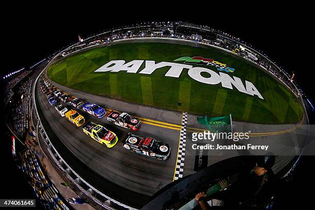 Ben Kennedy, driver of the Florida Lottery/Whelen Chevrolet, leads the field to the green flag to start the Camping World Truck Series NextEra Energy...