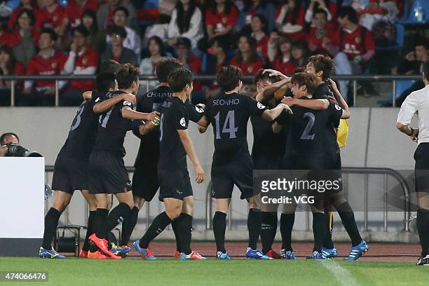 Jorge De Moura Xavier of Seongnam FC celebrates with team mates after scoring his team's first goal during the AFC Champions League Round of 16 match...