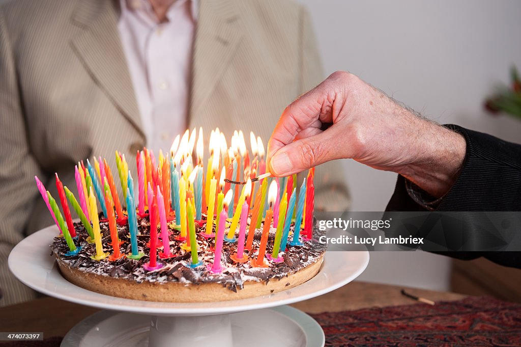 Lighting 93 candles on a cake
