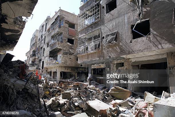 Debris remain scattered after the battle against the Islamic State militant group at the government-occupied area of the Yarmouk Camp on May 17, 2015...