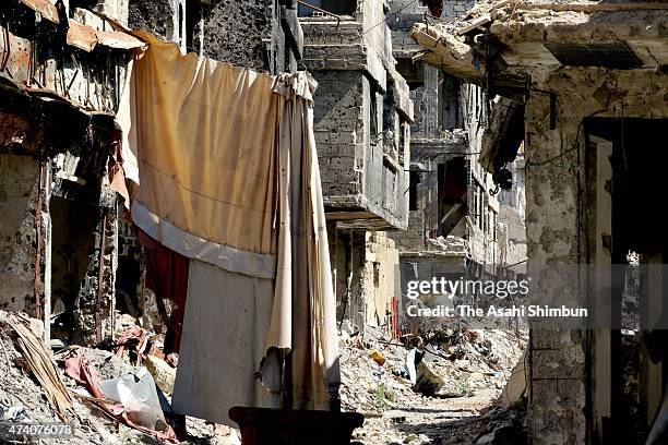 Debris remain scattered after the battle against the Islamic State militant group at the government-occupied area of the Yarmouk Camp on May 17, 2015...