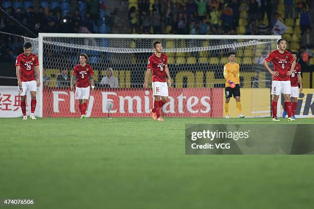 Guangzhou Evergrande players react after losing the AFC Champions League Round of 16 match between Seongnam FC and Guangzhou Evergrande at Tancheon...