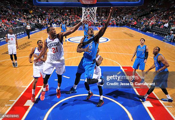 Bernard James of the Dallas Mavericks grabs the rebound against the Philadelphia 76ers at the Wells Fargo Center on February 21, 2014 in...