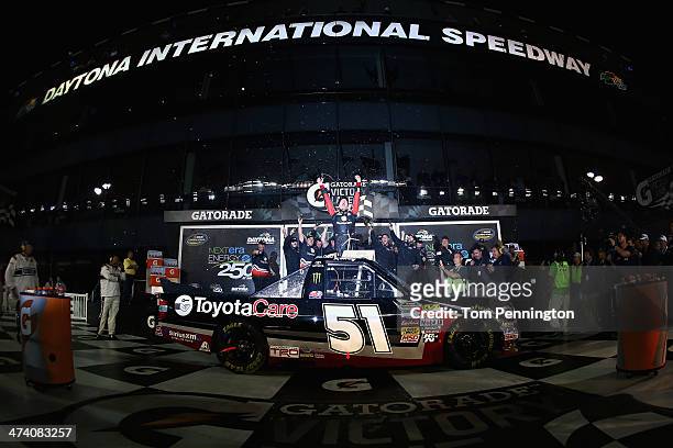 Kyle Busch, driver of the ToyotaCare Toyota, celebrates in Victory Lane after winning the Camping World Truck Series NextEra Energy Resources 250 at...