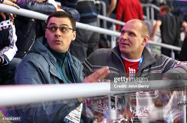 Olympians Alexander Popov and Alexander Karelin of Russia attend the Men's Ice Hockey Semifinal Playoff between Sweden and Finland on Day 14 of the...