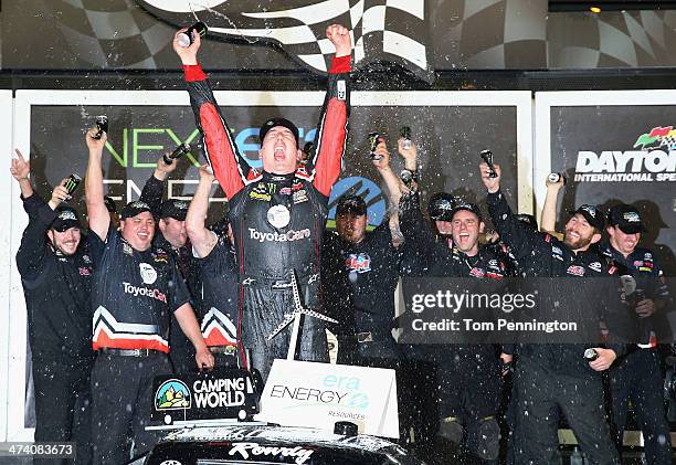 Kyle Busch, driver of the ToyotaCare Toyota, celebrates in Victory Lane after winning during the Camping World Truck Series NextEra Energy Resources...
