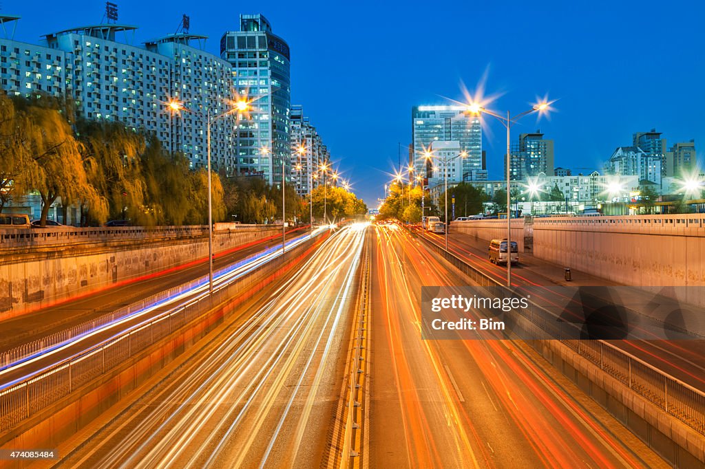 Night Street Scene with Car Light Trails in Beijing, China
