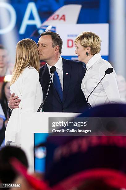 Andrzej Duda is given support from his wife, Agata, and daughter, Kinga, at a press conference as part of his campaign on May 20, 2015 in Warsaw,...