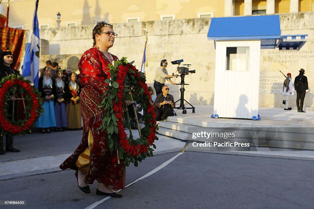 People in traditional Pontic dress wait with the wreaths...