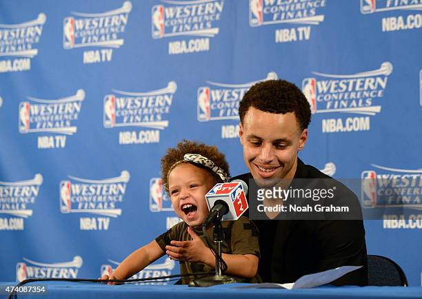 Stephen Curry of the Golden State Warriors and his daughter Riley talking with the media at a press conference after the game against the Houston...