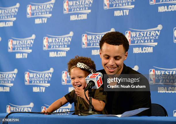 Stephen Curry of the Golden State Warriors and his daughter Riley adressing the media at a press conference after the game against the Houston...