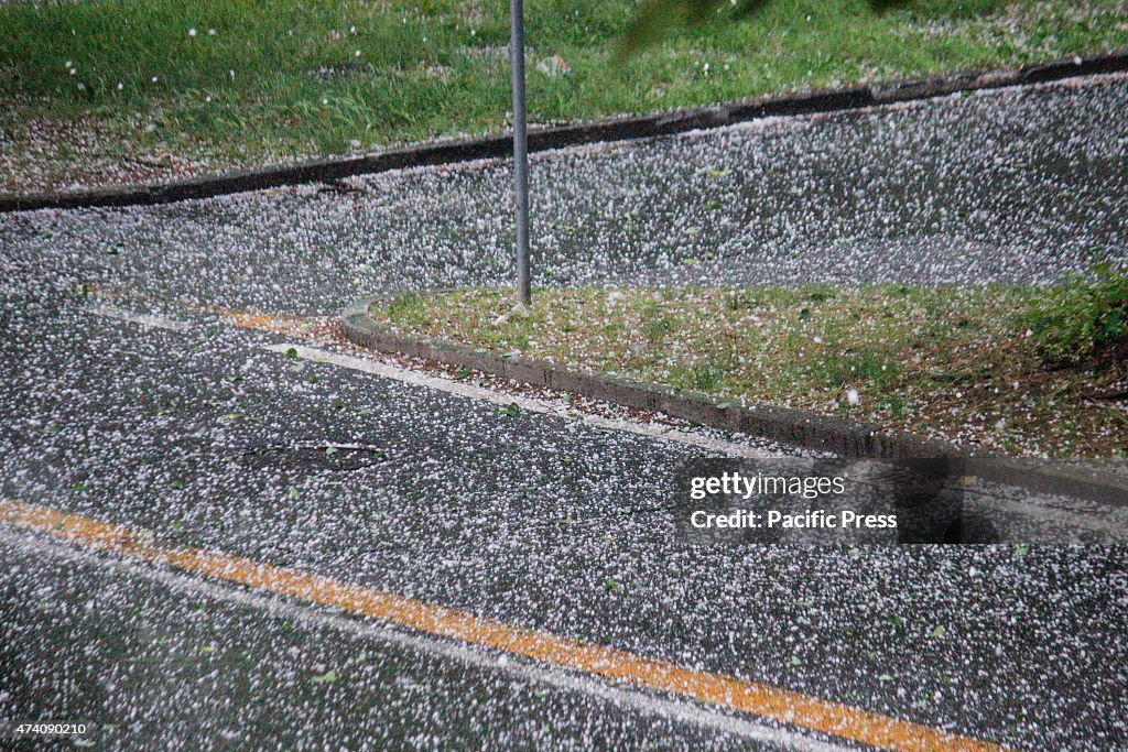 A sudden hailstorm hit the city of  Turin, making the road...