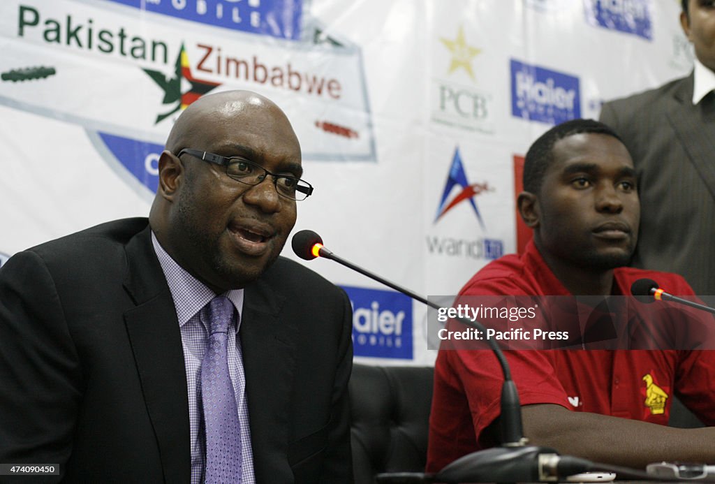 Zimbabwe's cricket team head, Ozias Bvute (left ) speaks at...