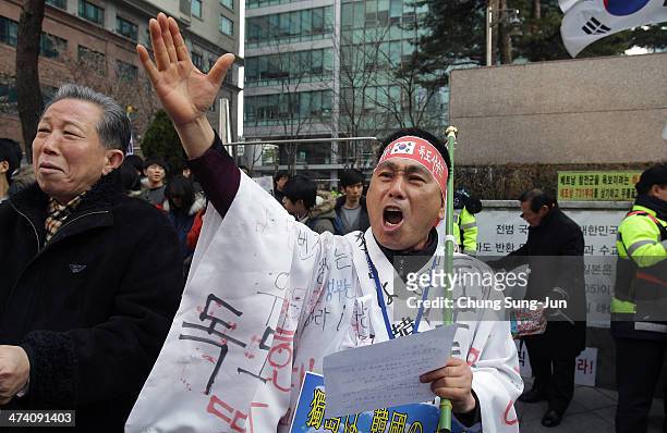 South Korean activists shout slogans during an anti-Japan rally in front of the Japanese embassy on February 22, 2014 in Seoul, South Korea. Both...